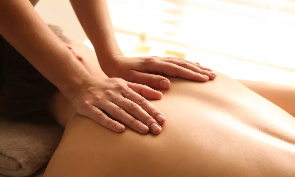 50-Min Therapeutic Massage + Hot Stones for 1 or Couples or 60-Min Custom Combo Massage (Up to 50% Off)