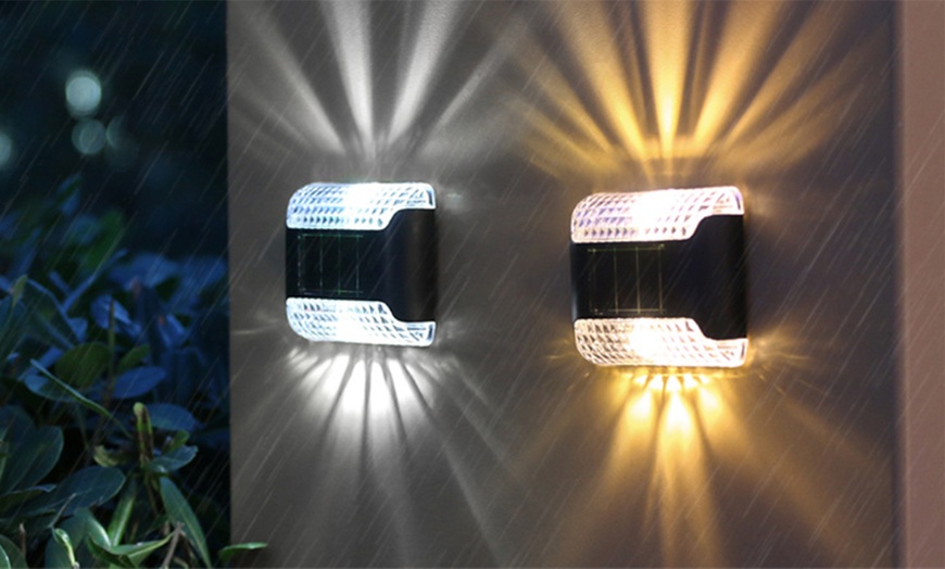 Image 1: Two or Four Piece Solar Up And Down LED Wall lights