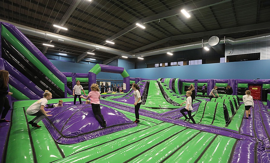 Image 1: Inflatable Jump Sessions at Aura Inflatable Park 