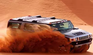 Hummer Desert Safari With BBQ Dinner for Child or Up to Six Adults at Arabian Kings Tours (Up to 38% Off)
