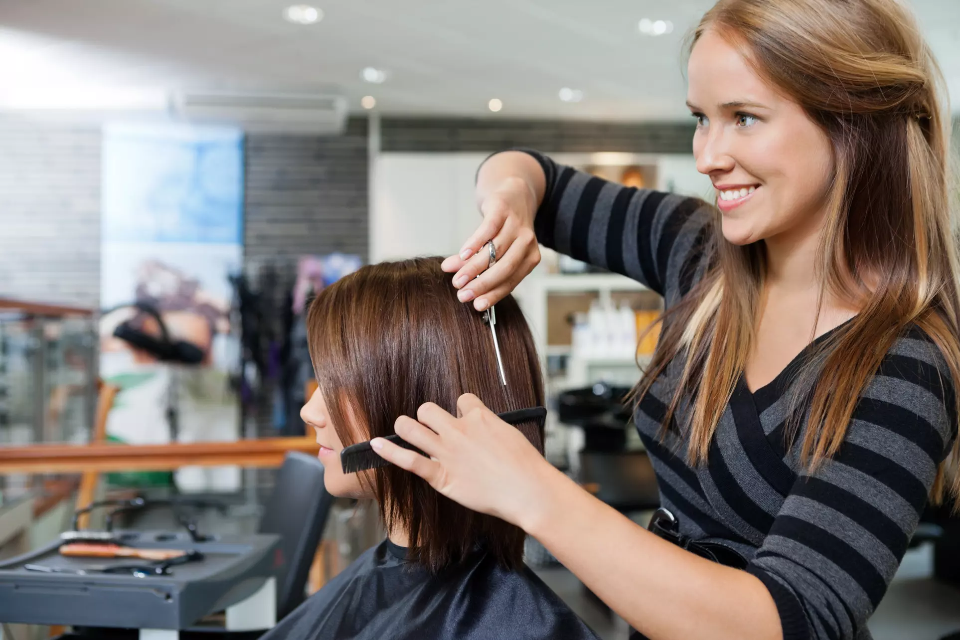 One Haircut with Optional Color and Blow-Dry or Three Haircuts at Michael Anthony Salon and Spa (Up to 56% Off) - Primary Image