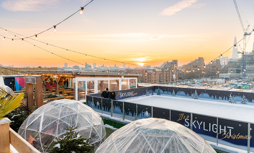 Image 10: Rooftop Ice Skating with meal, Raclette or Cocktails