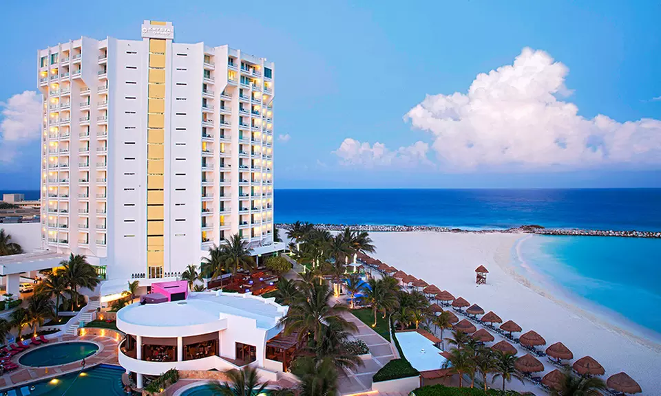✈ 3-, 4-, 5-, 6-, or 7-Night Krystal Grand Punta Cancun Stay with Airfare. Price per Person Based on Double Occupancy. - Primary Image