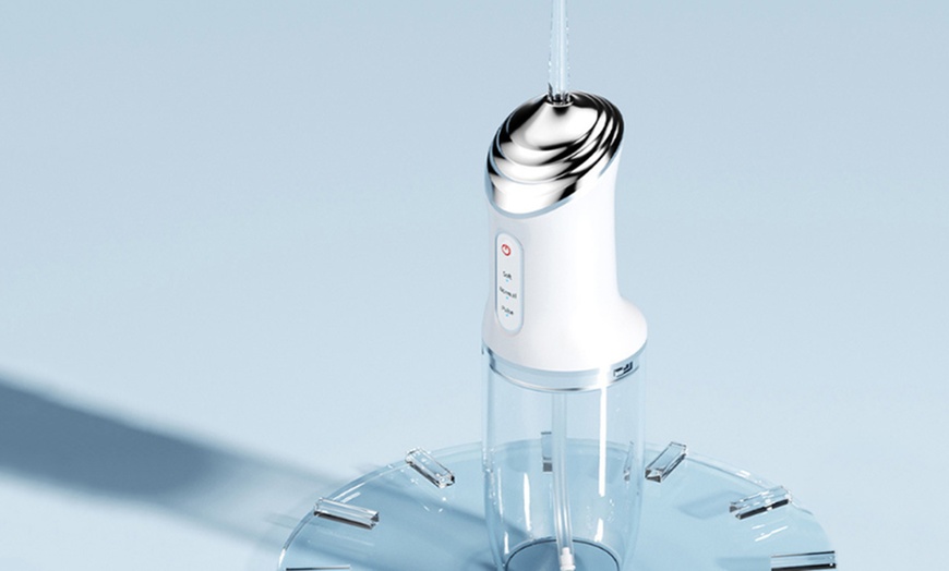 Image 7: Three Modes Electric Cordless Water Flosser for Teeth
