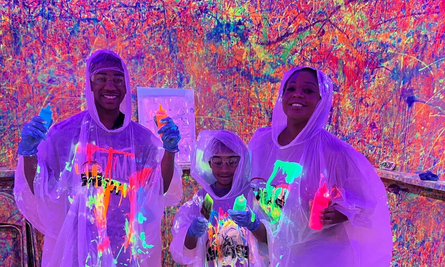 Blacklight Paint Splatter Session with Take-Home Canvas at iSmash