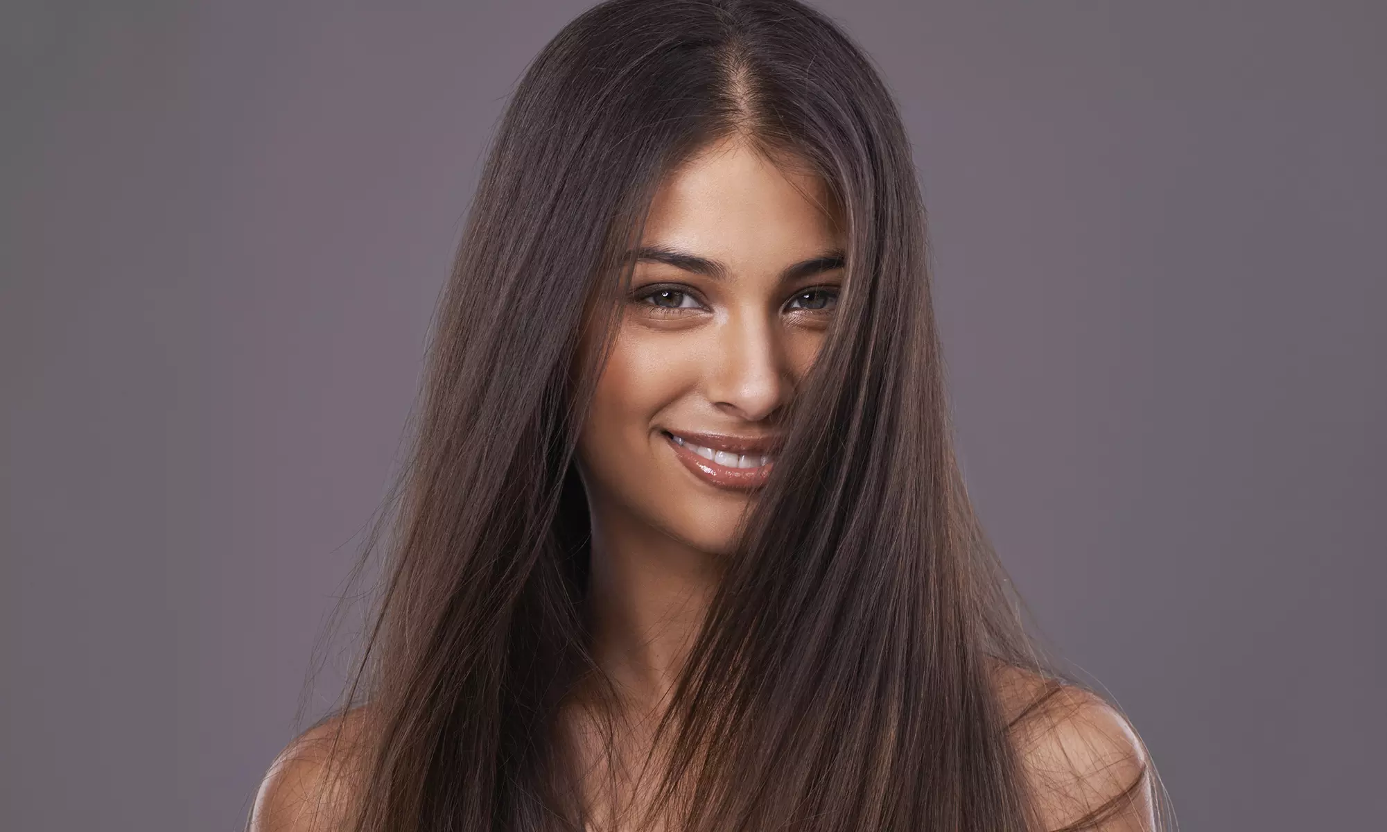 Achieve Sleek Hair with Brazilian Blowout Treatments at Studio M Hair Design - Up to 60% Off - Primary Image