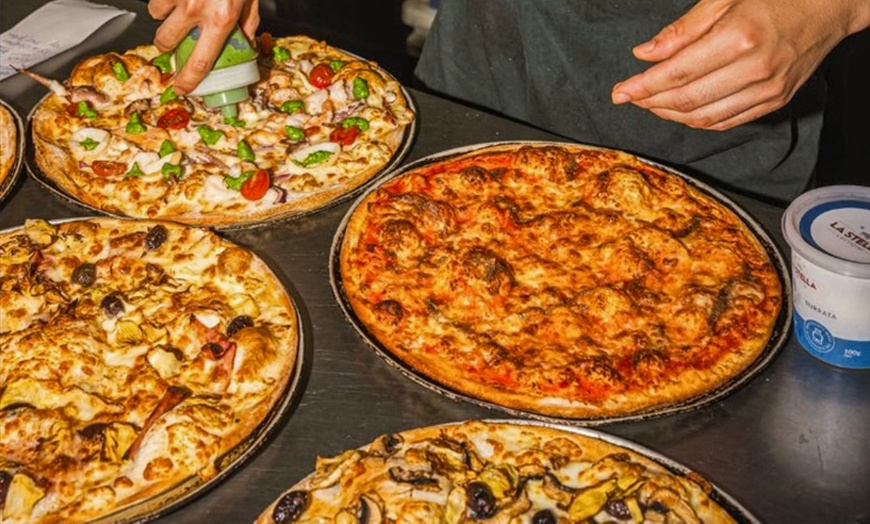 Image 1: Up to 56% Off on Pizza Place at CAPO PIZZA