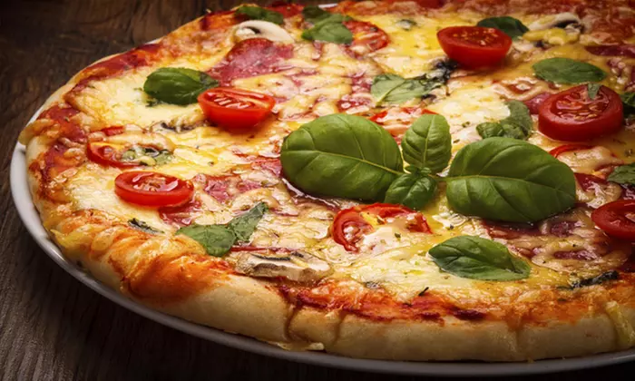 Pizza and Pasta at Plum Tomatoes (Up to 50% Off) - Primary Image