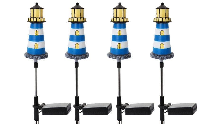 Image 8: One, Two or Four Solar Powered Lighthouse Shaped Garden Lights