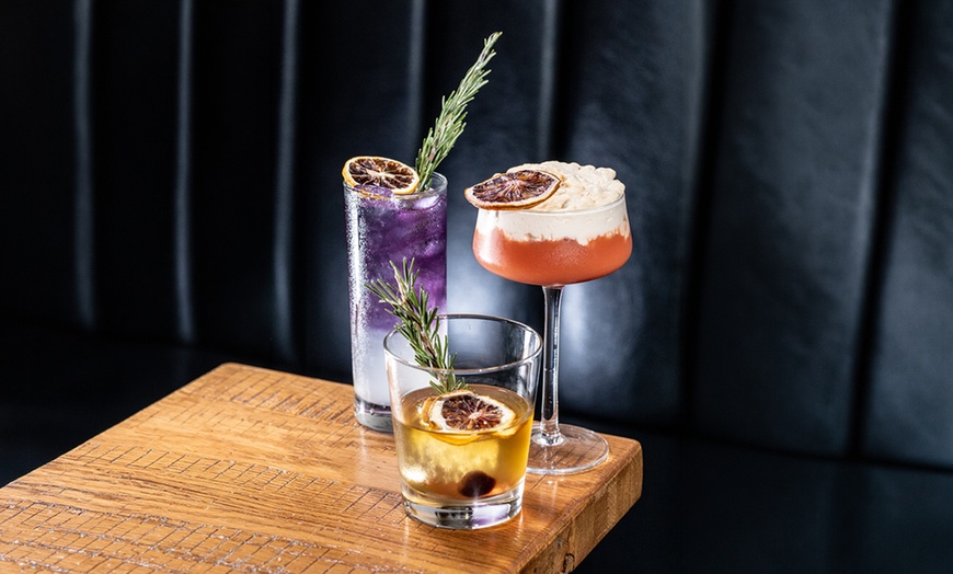 Image 7: Dinner for Two or Four with Cocktails or $50 or $100 Dining Credit