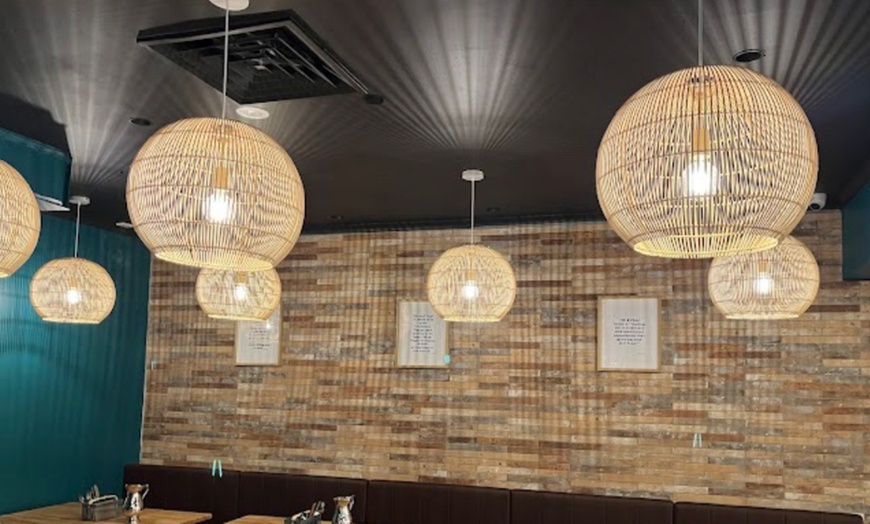 Image 6: Get $50–$150 Toward Food & Drinks at Me & Yogi Indian Kitchen
