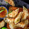 Image 1: Dumpling Feast with Spring Rolls or Buns and Drinks for 2 or 4 People