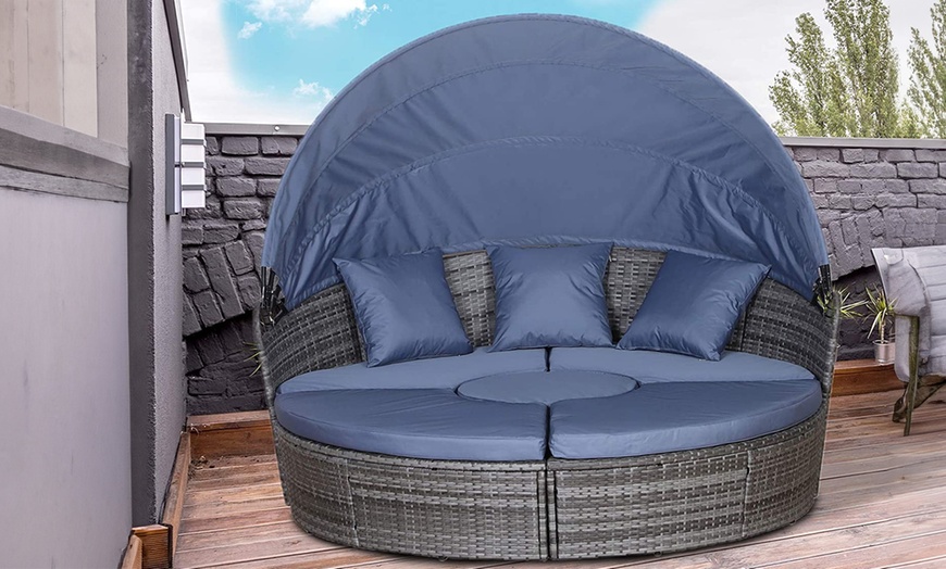 Image 1: Outsunny Rattan-Effect Round Sofa Bed with Retractable Canopy