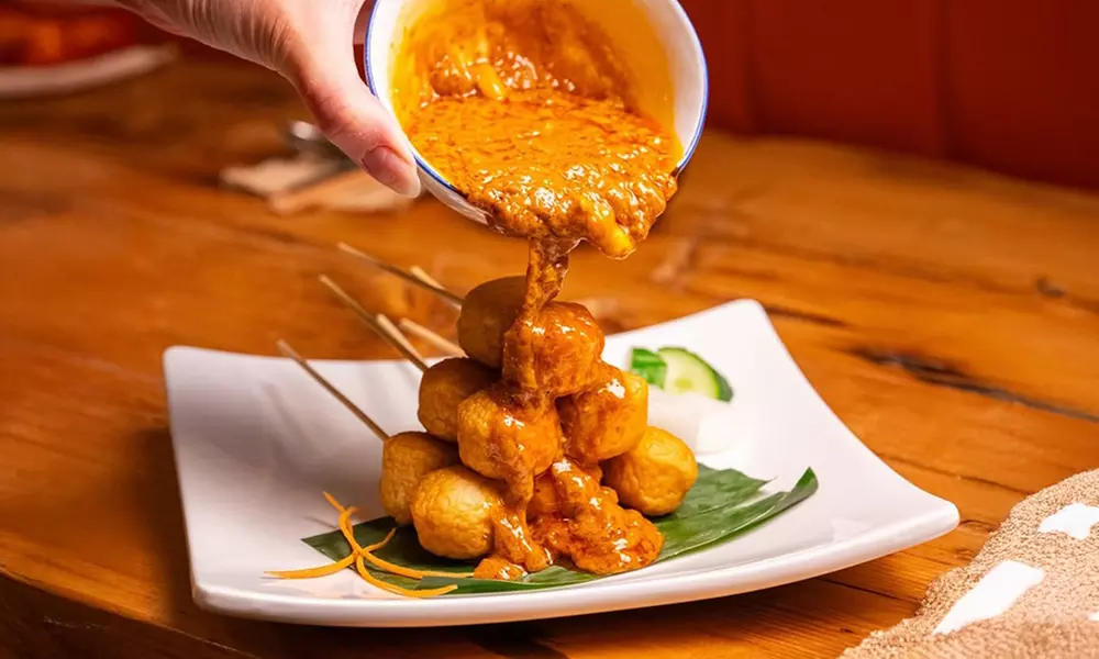 Savor $50 Dining Credit or Dinner with Cocktails for Two or Four