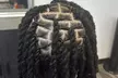 Up to 33% Off Revitalize Your Look with Loc Retwist or Silk Press Services - Zhanés Hair fortress - Second Medium