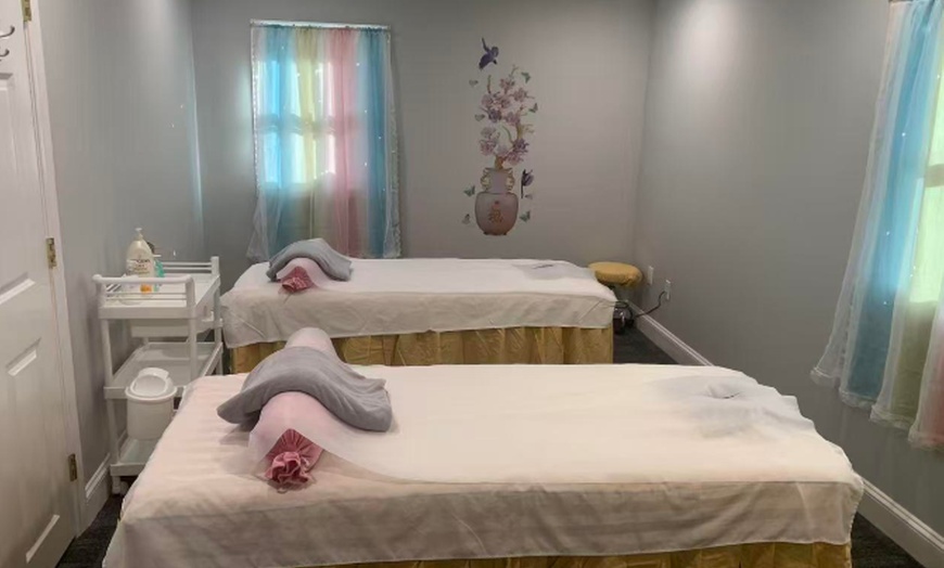 Image 1: 1 or 2 30-Min Signature Bodywork Sessions & Hot Stones/ Couples Option