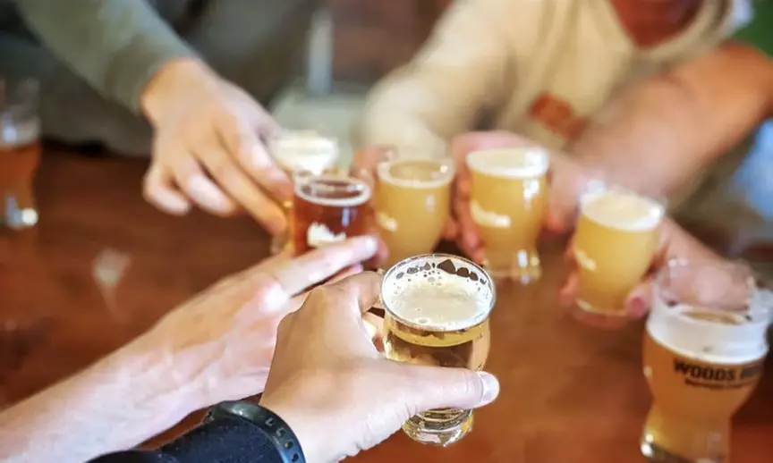 Crowler, Pint, Koozie & Sunglasses for One, Two or Four from Woods Boss Brewing (Up to 40% Off) - Second Medium