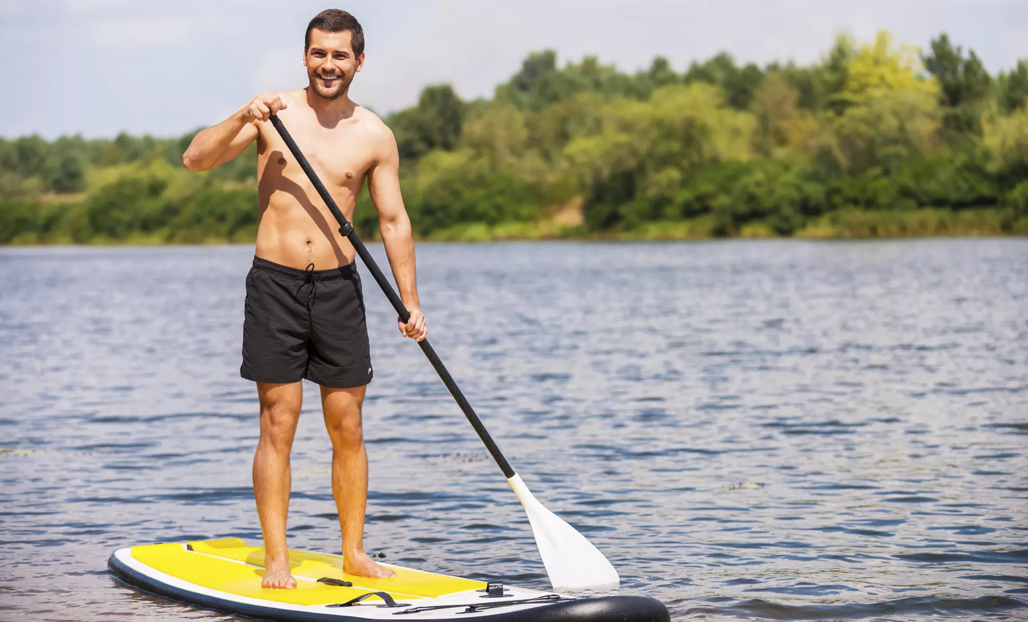 Standup Paddleboard Beginner Classes, Kayak Rental, or SUP Yoga at DFW SURF (Up to 36% Off). 3 Locations - Primary Image