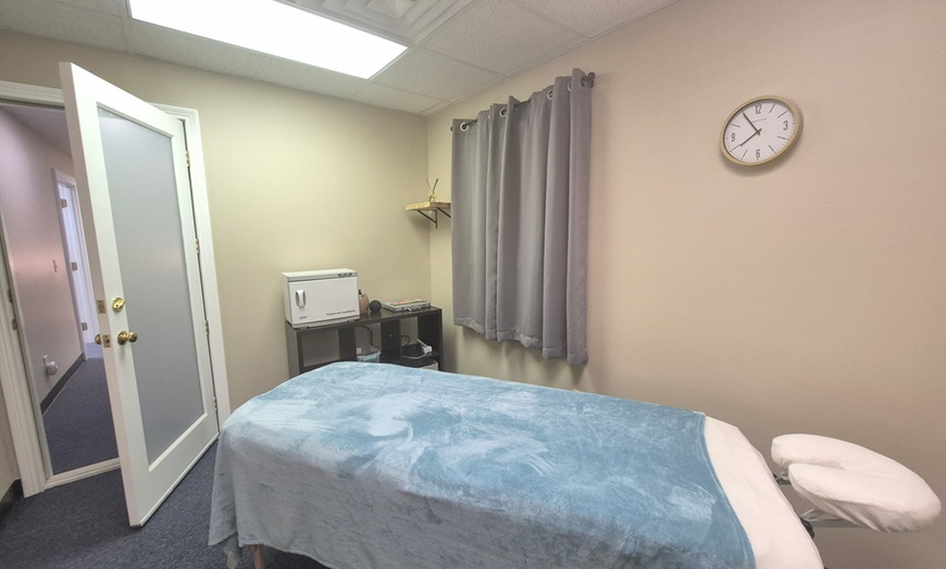 Image 2: Therapeutic, Hot Stone & Bamboo Massage Deal | Edgewood, KY