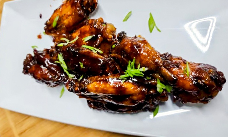 Image 2: $25, $50, $75 Towards Food or Hibiscus Jerk Wings & Choice of Drink!