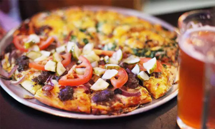 $15 for $30 Worth of Pizza, Sandwiches, and Calzones at Mission Pizza & Pub - Primary Image