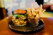 $50 or $100 Towards Food, Drink & Bay Rentals at Hackers Bar & Grille at Hackers At Hilltop (Up to 37% Off) - Second Medium