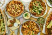 Enjoy $25, $50,/ $100 Food & Drink or One or Two Pizza with Toppings (Up to 39% Off) - Second Medium