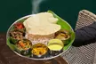Delicious Indian starter, our main Koottaan Signature main course, and wine for 2 at Koottaan (Up To 44% Off) - Second Medium