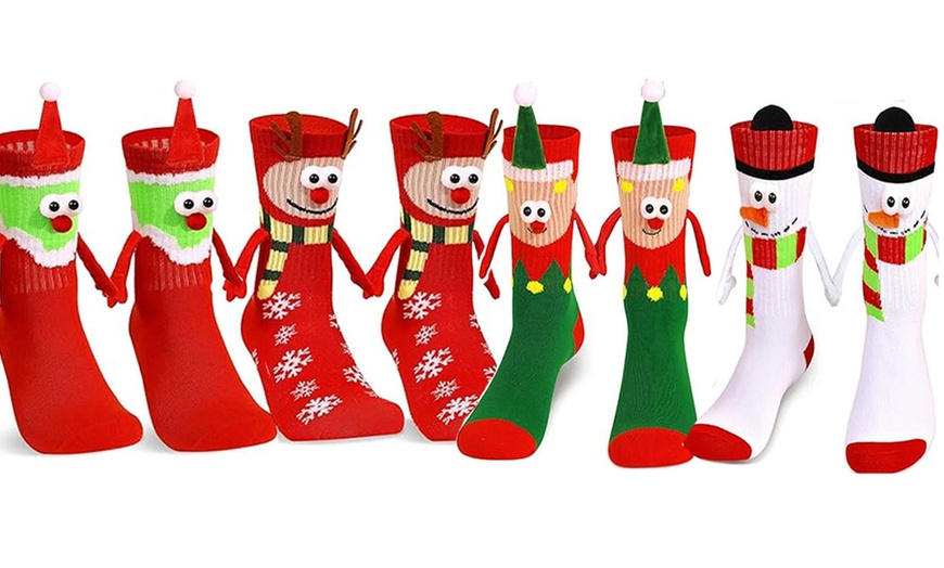 Image 4: Pack of Four Magnetic Hand-Holding 3D Christmas Socks
