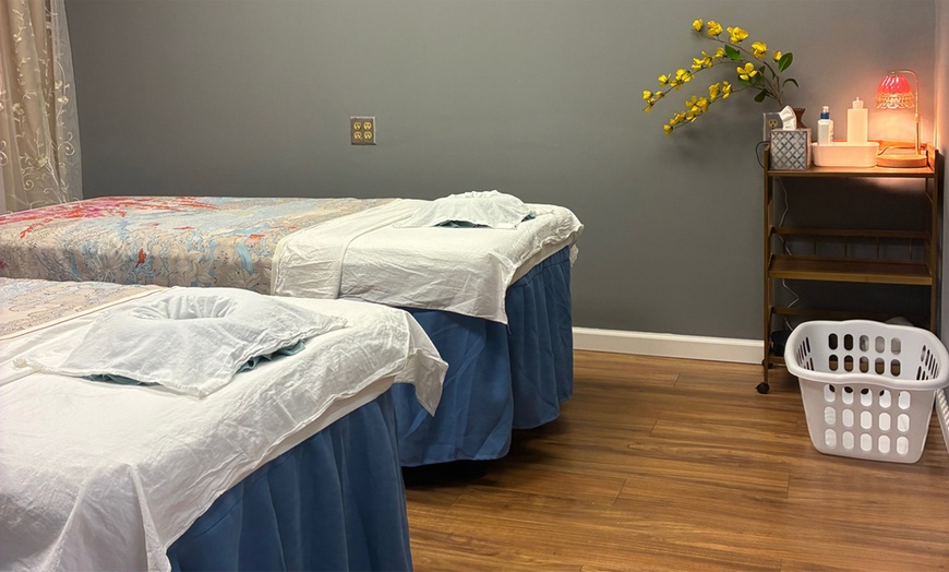 Image 2: 60 or 90-Minute Massage with Hot Stone, Hot Pillow, Deep Tissue & Oil