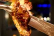 All-You-Can- Eat Brazilian Steakhouse Rodizio + 1 glass of Wine or Beer for 2 or 4 People (Up to 19% Off) - Second Medium