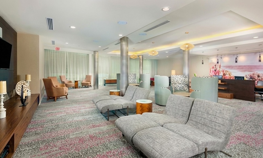 Image 12: Courtyard-Style Hotel Retreat with Outdoor Pool & Bistro Dining