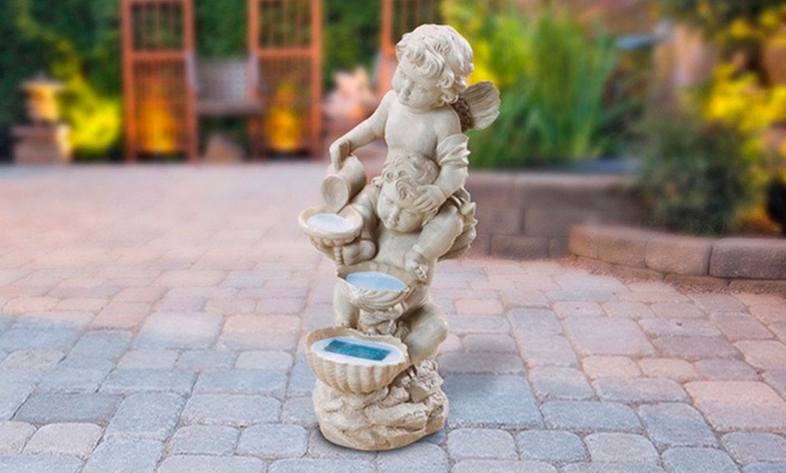 Image 1: Cherub Sculpture Solar-Powered Garden Light