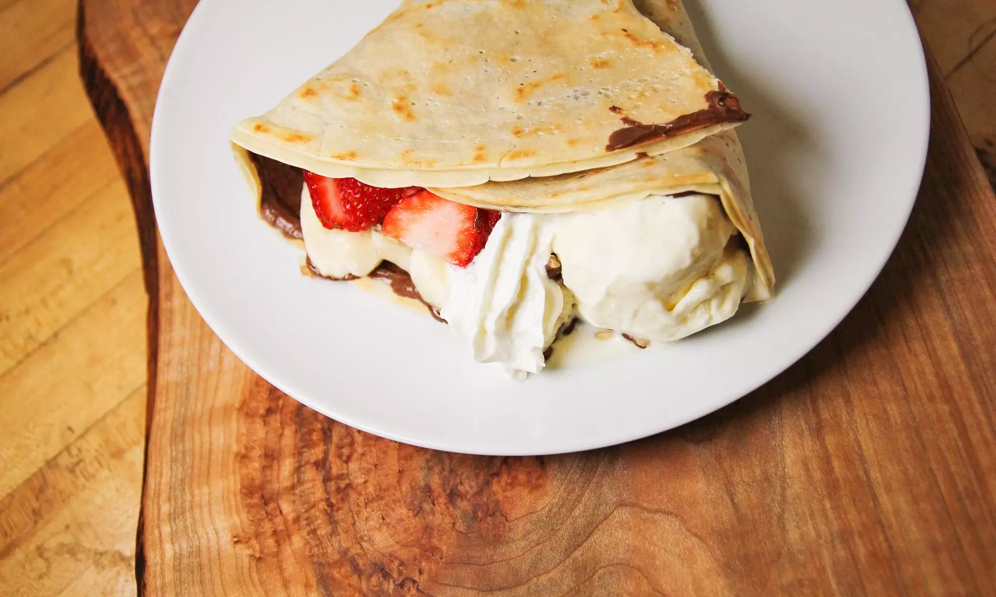 One or Three Groupons, Each Good for $10 Worth of Sweet & Savory Crepes and Gelato at Crepe Delicious (30% Off) - Primary Image