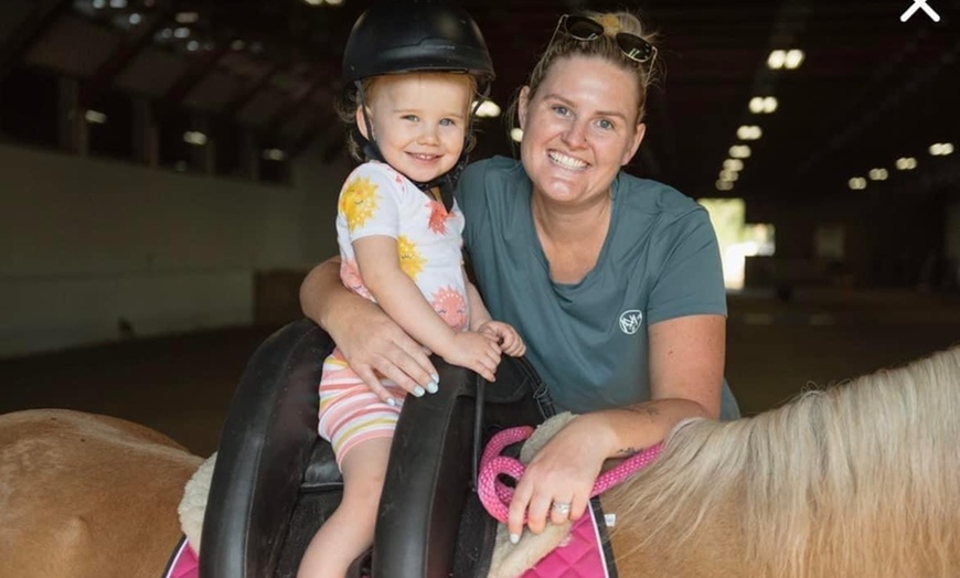 Image 1: 30 or 60-Min Horseback Riding Lessons: One or Parent/Tot – Select Days