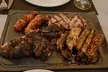 Parrillada para 2 o 4 con aperitivo, entrantes, postres y bebida, opción a botella de vino con hasta 76% menos - Second Medium