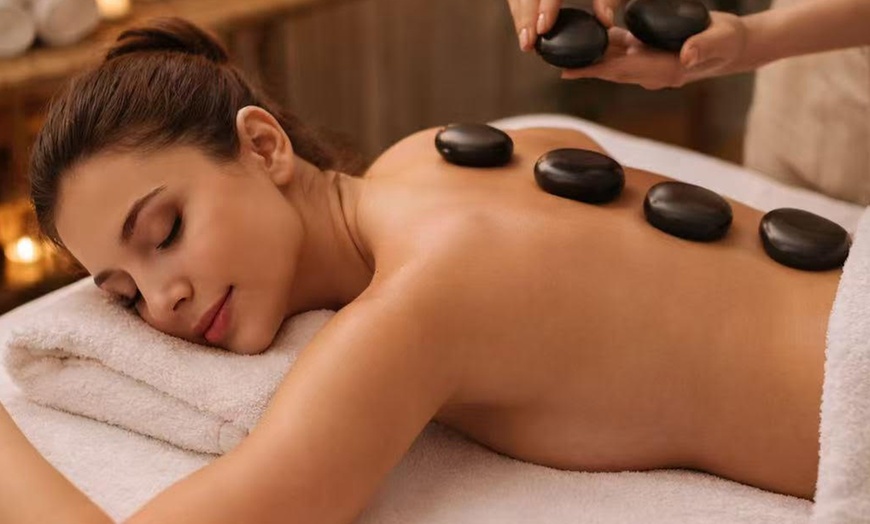 Image 2: 90-, or 120-Min Hotstone Massage, Foot Bath & Reflexology or Facials