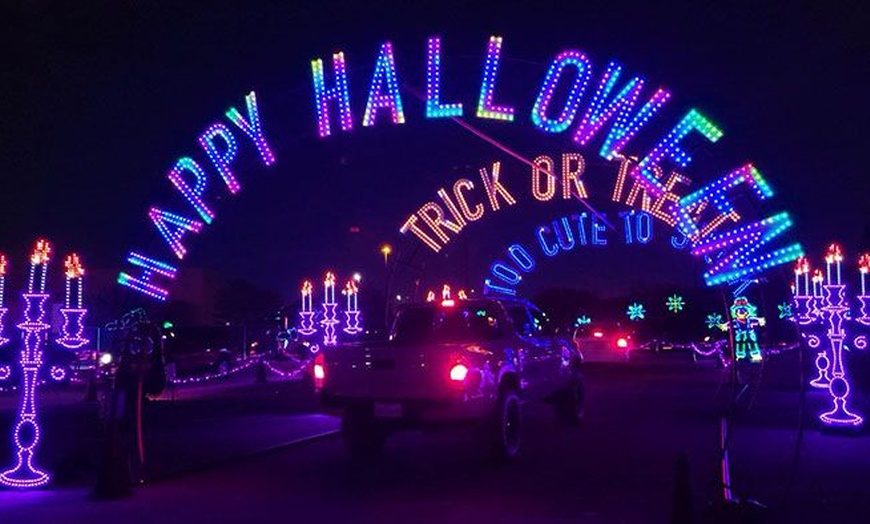 Image 3: Enchanted Lights: A Mile-Long Halloween Themed Drive-Thru Light Show