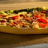 Image 5: Savor the flavors with 25% off on stone-baked pizzas