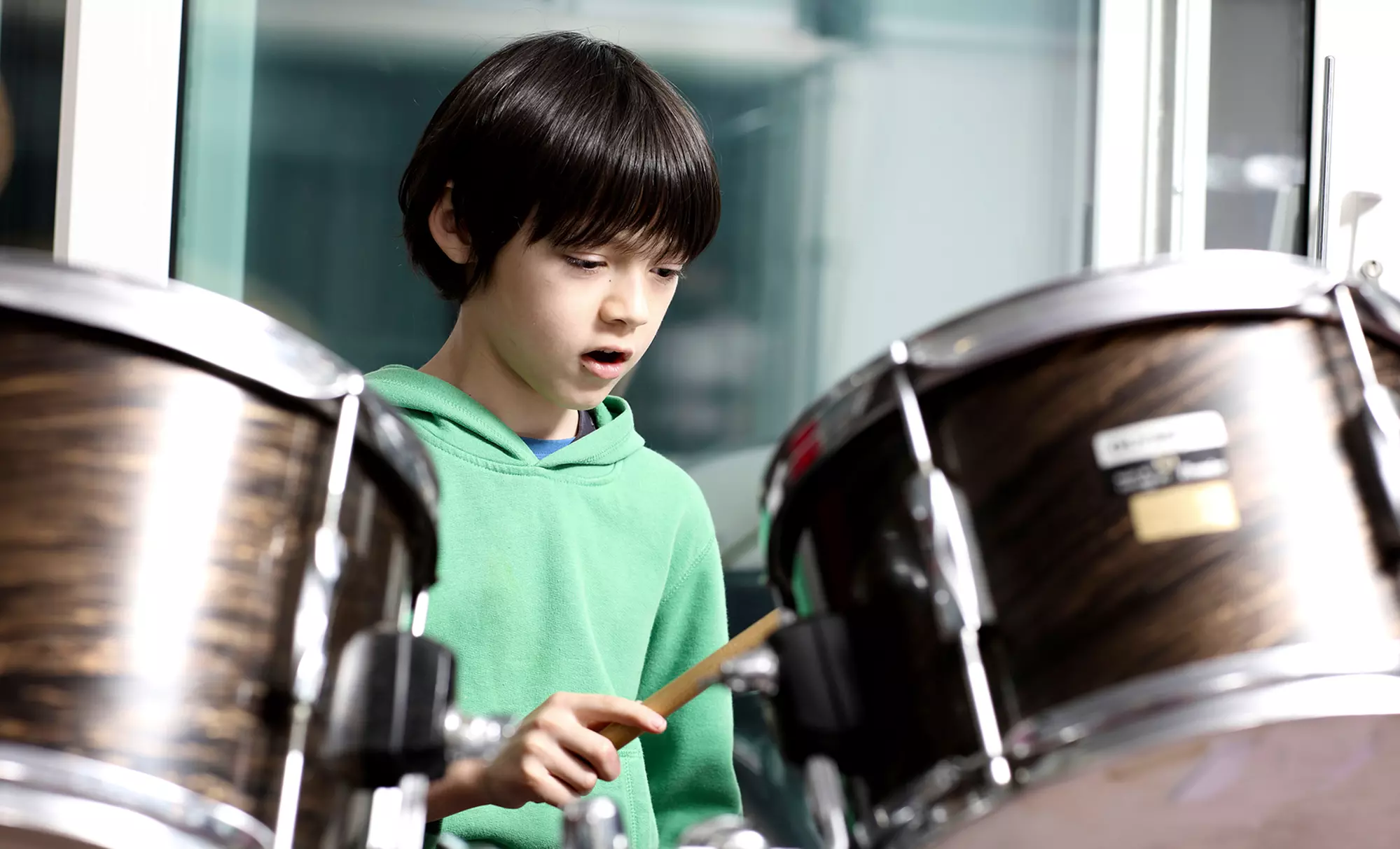 Explore Amped Music School's private lessons in guitar, piano, drums, or vocals with up to 50% off. Perfect your musical skills! - Primary Image