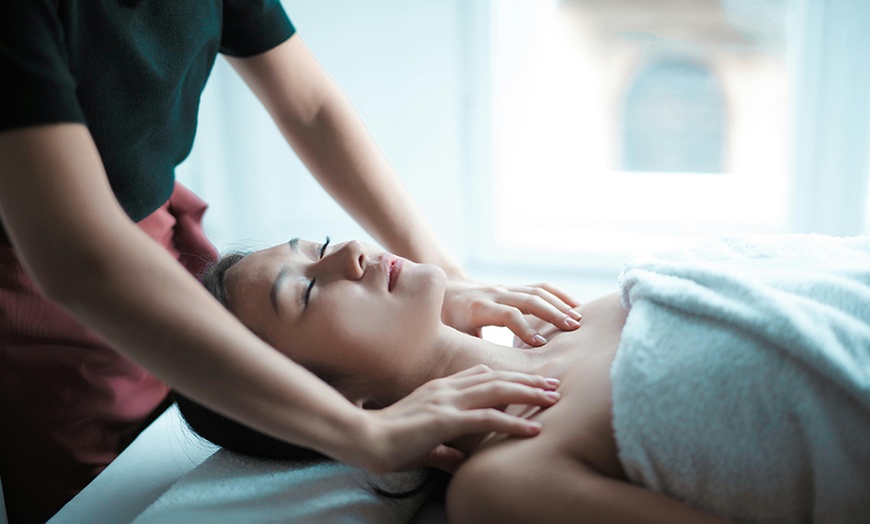 Image 1: Relax and Rejuvenate with a 60-Minute Hot Stone Treatment