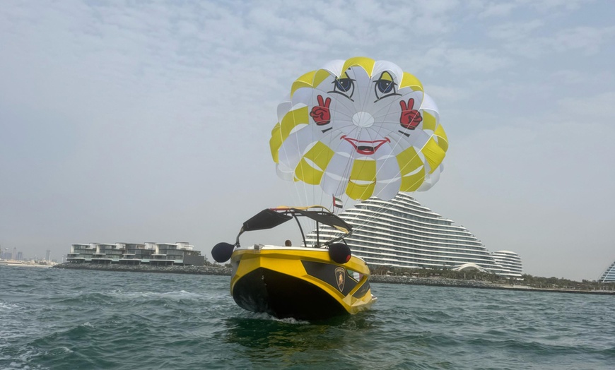 Image 1: Soar Above Dubai's Coastline with 30-Minute Parasailing for One or Two