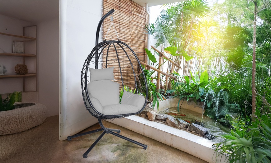 Image 1: Swinging Rattan-Effect Egg Chair