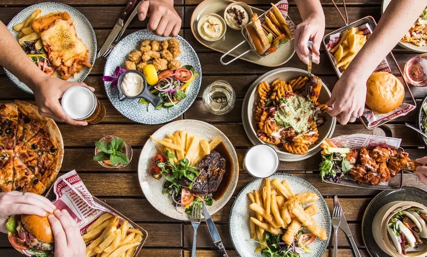 Image 1: Burger & Schnitzel Meal Deal for Two or Four at Biggles Bar & Grill in Mascot