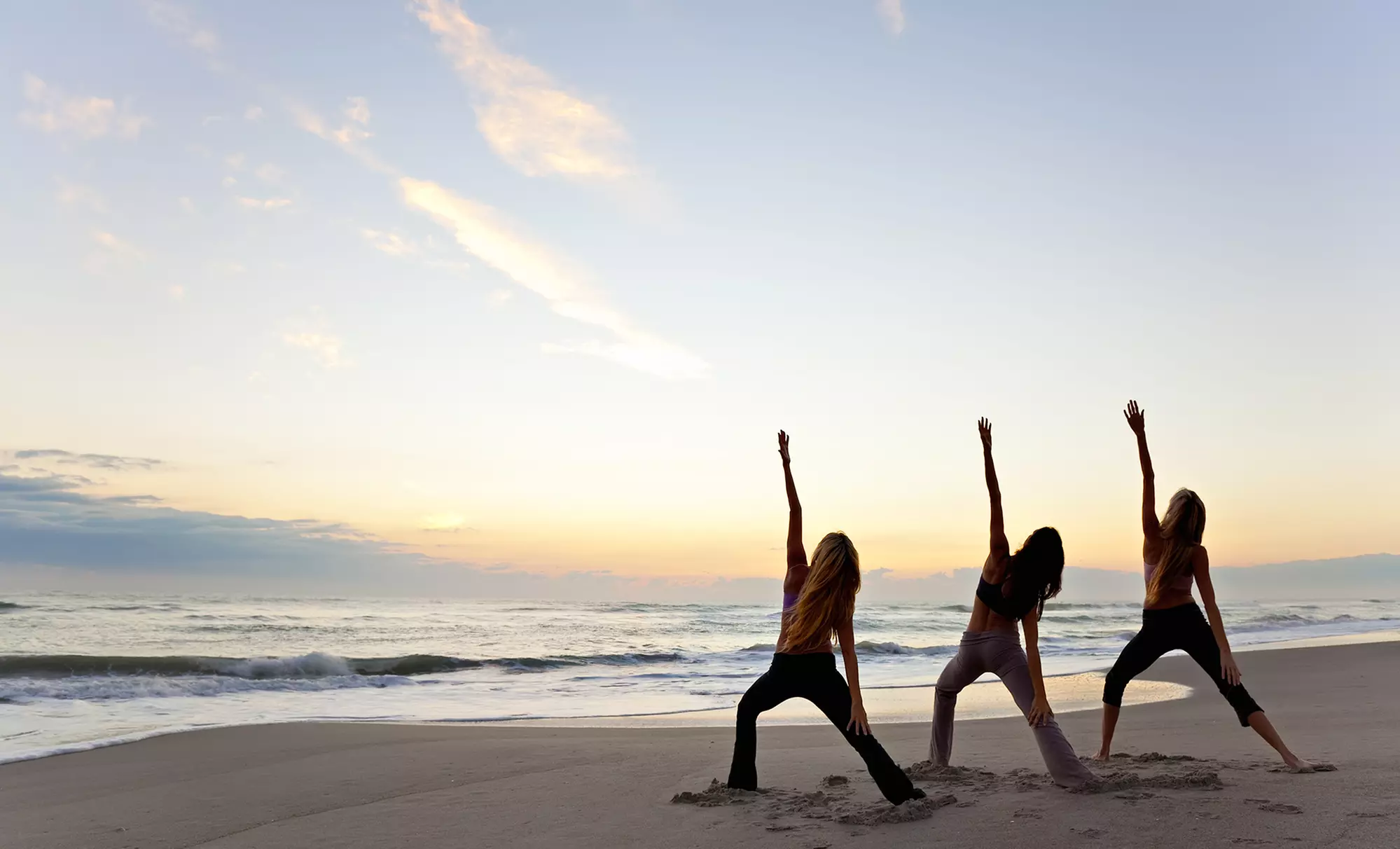 5, 10, or Month Unlimited Beach Yoga Classes, or Standup Paddleboard Yoga at Beach Yoga Pinellas (Up To 54% Off) - Primary Image