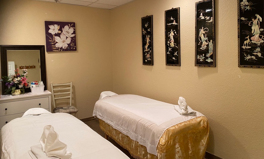 Image 1: One or Couples 60-Min Thai Massage with Optional Oil and Hot Stones 