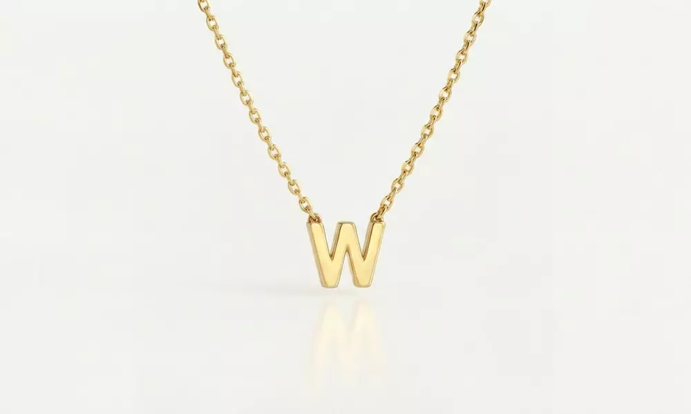 Design a unique 14K solid gold initial necklace with Becca Prado, featuring customizable options from 1 to 8 letters