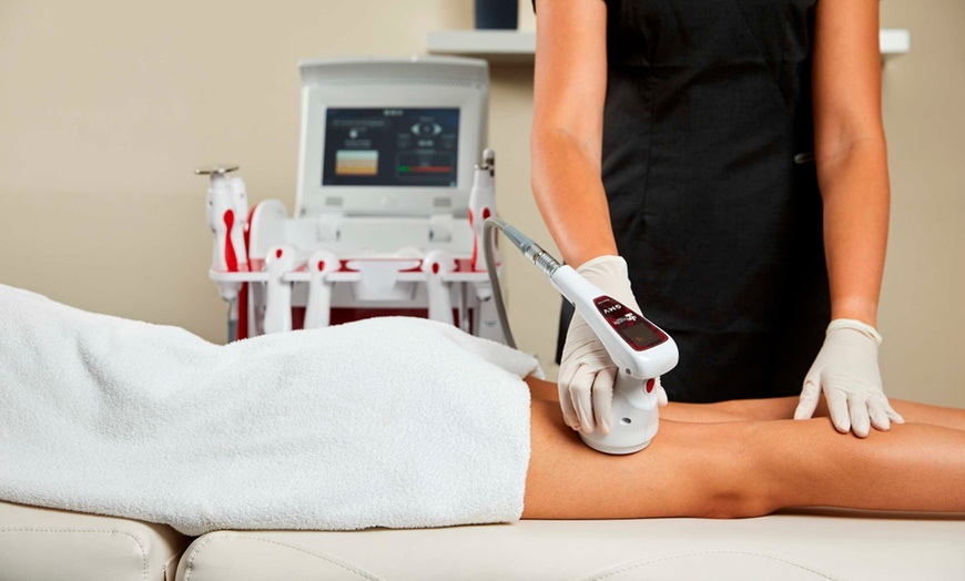 Image 1: Fat Reduction & Skin Tightening for Two Areas — 1, 2, or 4 Sessions