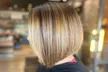 Haircut & Deep Condition w/ Optional Scalp Massage or Brazilian Blowout at The Beauty Room (Up to 50% Off) - Second Medium