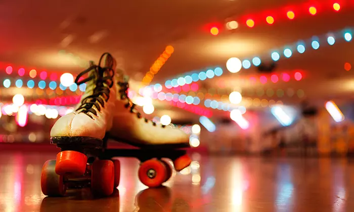 Admission and Skate Rental for Two or Four, Plus Pizza at Looneys Super Skate Center (Up to 52% Off)  - Primary Image
